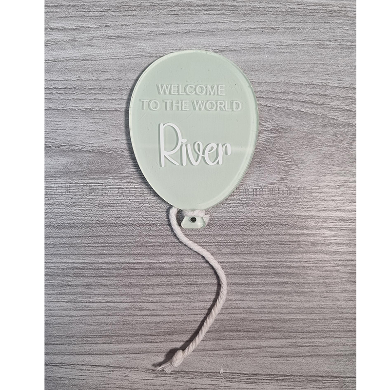 Pastel Green painted balloon acrylic with Welcome To The World River example