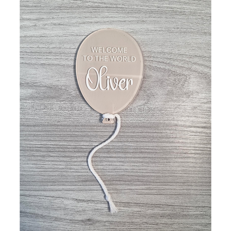 Beige painted balloon acrylic with Welcome To The World Oliver example