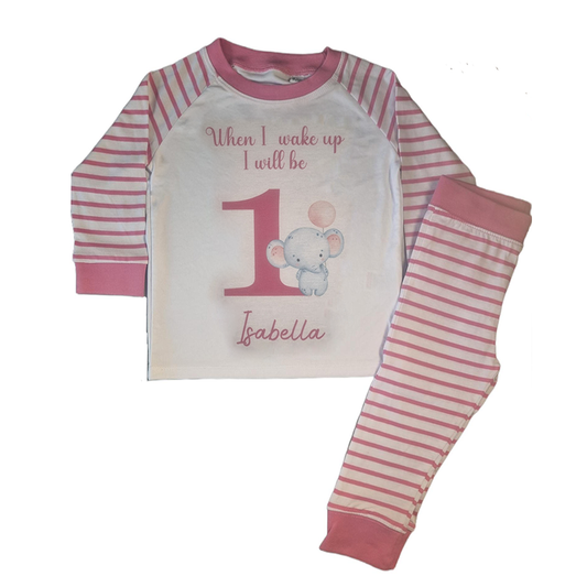 'When I wake up I will be' 1 pink and white stripe pyjamas with elephant holding pink balloon, includes child's name, flat top and folded bottoms 