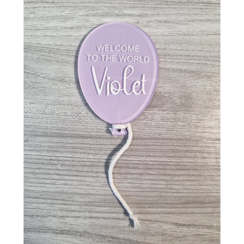 Purple painted balloon acrylic with Welcome To The World Violet example